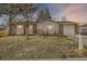 Charming single-story home with a well-manicured front yard and attached garage at 6233 W 75Th Ave, Arvada, CO 80003