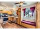 Cozy kitchen features wood cabinets, stainless steel appliances, and a window seat perfect for enjoying your morning coffee at 6233 W 75Th Ave, Arvada, CO 80003