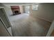 Comfortable living room with a red brick fireplace and sliding glass door at 6233 W 75Th Ave, Arvada, CO 80003