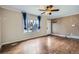 Inviting living room featuring hardwood floors, neutral walls, and a large window at 6233 W 75Th Ave, Arvada, CO 80003