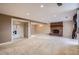 Expansive living room featuring a brick fireplace, neutral carpet, and recessed lighting at 6233 W 75Th Ave, Arvada, CO 80003