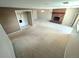 Spacious living room featuring a brick fireplace and an open floor plan at 6233 W 75Th Ave, Arvada, CO 80003