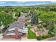 A view of a backyard that offers a peaceful retreat with mature landscaping and a large brick patio at 841 Beech St, Golden, CO 80401