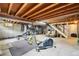 Unfinished basement featuring work-out equipment and exposed ceiling at 841 Beech St, Golden, CO 80401