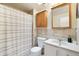 Cozy bathroom featuring a toilet, vanity, mirror, cabinet, and shower at 841 Beech St, Golden, CO 80401