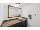 Bathroom featuring a dark vanity, granite countertop, and bowl sink at 841 Beech St, Golden, CO 80401