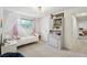 Bright bedroom with a window, a dresser, and pink curtains at 841 Beech St, Golden, CO 80401
