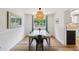 Bright dining area with decorative light fixture and backyard view at 841 Beech St, Golden, CO 80401
