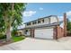 Charming two-story home with a two car garage, beautiful brick accents, and well-manicured lawn at 841 Beech St, Golden, CO 80401