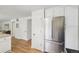 Hallway with access to a kitchen featuring stainless appliances at 841 Beech St, Golden, CO 80401
