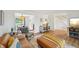 Spacious living room with hardwood floors, staircase, and neutral decor at 841 Beech St, Golden, CO 80401