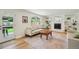 Cozy living room with hardwood floors, fireplace, and easy access to patio at 841 Beech St, Golden, CO 80401