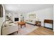 Light-filled living room with hardwood floors, fireplace, and comfortable seating at 841 Beech St, Golden, CO 80401
