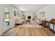 Bright living room featuring hardwood floors, fireplace, and built-in bookshelves at 841 Beech St, Golden, CO 80401