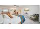 Bright main bedroom with ceiling fan, television, chair, and ensuite access at 841 Beech St, Golden, CO 80401