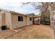 Exterior shot of home with a covered back deck and gravel landscaping at 6522 S Hoyt Way, Littleton, CO 80123