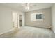 Bright bedroom with a ceiling fan, soft carpet, and a window with lots of natural light at 6522 S Hoyt Way, Littleton, CO 80123