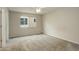 Bedroom with neutral walls, carpeted floor and a window allowing natural light to fill the room at 6522 S Hoyt Way, Littleton, CO 80123