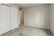 Bedroom with carpet, double closet, and a doorway leading to another area at 6522 S Hoyt Way, Littleton, CO 80123