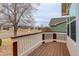 View from the front porch showing the neighborhood streetscape with mature trees and nearby homes at 6522 S Hoyt Way, Littleton, CO 80123