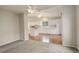 View from living room into kitchen with ceiling fans at 6522 S Hoyt Way, Littleton, CO 80123