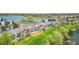 Aerial view of residences located next to a lake and well manicured lawn at 10550 W Jewell Ave # 301, Lakewood, CO 80232