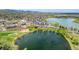 Aerial view of community with ponds and surrounding neighborhood at 10550 W Jewell Ave # 301, Lakewood, CO 80232