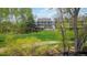 Residence with lush green lawn adjacent to the lake and walking path at 10550 W Jewell Ave # 301, Lakewood, CO 80232