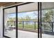 Balcony view with sliding glass doors overlooking the lawn and lake at 10550 W Jewell Ave # 301, Lakewood, CO 80232