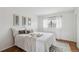 Bright bedroom with wooden floors, neutral decor, and ample natural light through a large window at 10550 W Jewell Ave # 301, Lakewood, CO 80232