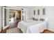 Bedroom with stylish décor, opening to a dining area with natural light and a view at 10550 W Jewell Ave # 301, Lakewood, CO 80232