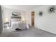 Bedroom with a comfortable bed, carpet flooring, wall decor, and a closet at 10550 W Jewell Ave # 301, Lakewood, CO 80232