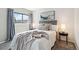 Cozy bedroom with a comfortable bed, stylish decor, and a bright window view at 10550 W Jewell Ave # 301, Lakewood, CO 80232