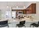 Modern kitchen featuring stainless steel appliances, bar seating and sleek countertop at 10550 W Jewell Ave # 301, Lakewood, CO 80232