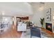 Bright and inviting living room features a cozy fireplace and open floor plan at 10550 W Jewell Ave # 301, Lakewood, CO 80232