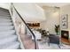 Open concept living room with a fireplace, seamlessly connecting to the kitchen at 10550 W Jewell Ave # 301, Lakewood, CO 80232
