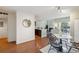 Open-concept living space featuring a modern kitchen, dining area, and cozy fireplace at 10550 W Jewell Ave # 301, Lakewood, CO 80232