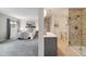 Open concept main bedroom with bathroom suite at 10550 W Jewell Ave # 301, Lakewood, CO 80232