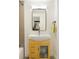 Stylish bathroom featuring a modern vanity with wooden cabinet and sleek mirror with lighting at 401 S Ivy St, Denver, CO 80224