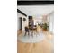 Open concept dining area with stylish chairs and view to the outside at 401 S Ivy St, Denver, CO 80224