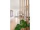 Stylish entryway featuring hardwood floors, contemporary artwork, and a view into the kitchen at 401 S Ivy St, Denver, CO 80224