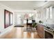 Inviting entryway with a stylish desk, modern art, and ample natural light, leading to the kitchen at 401 S Ivy St, Denver, CO 80224