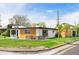 Stylish modern home with a well-manicured lawn, attractive wood accents, and a cozy seating area at 401 S Ivy St, Denver, CO 80224