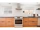 Modern kitchen featuring stainless steel appliances, sleek countertops, and ample storage space at 401 S Ivy St, Denver, CO 80224