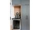 Modern kitchen with custom cabinetry, a built-in wine cooler, and premium stainless steel appliances at 401 S Ivy St, Denver, CO 80224