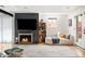 Cozy living room featuring a fireplace, modern furniture, and natural light at 401 S Ivy St, Denver, CO 80224