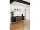 Stylish credenza with plant and artwork in living room at 401 S Ivy St, Denver, CO 80224