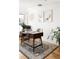 Bright home office with a stylish desk, a patterned rug, and plenty of natural light at 401 S Ivy St, Denver, CO 80224