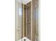 Modern shower featuring tiled walls, glass enclosure, and sleek showerhead at 401 S Ivy St, Denver, CO 80224