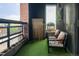 Relax on this outdoor balcony with artificial turf at 3420 W 32Nd Ave # 203, Denver, CO 80211
